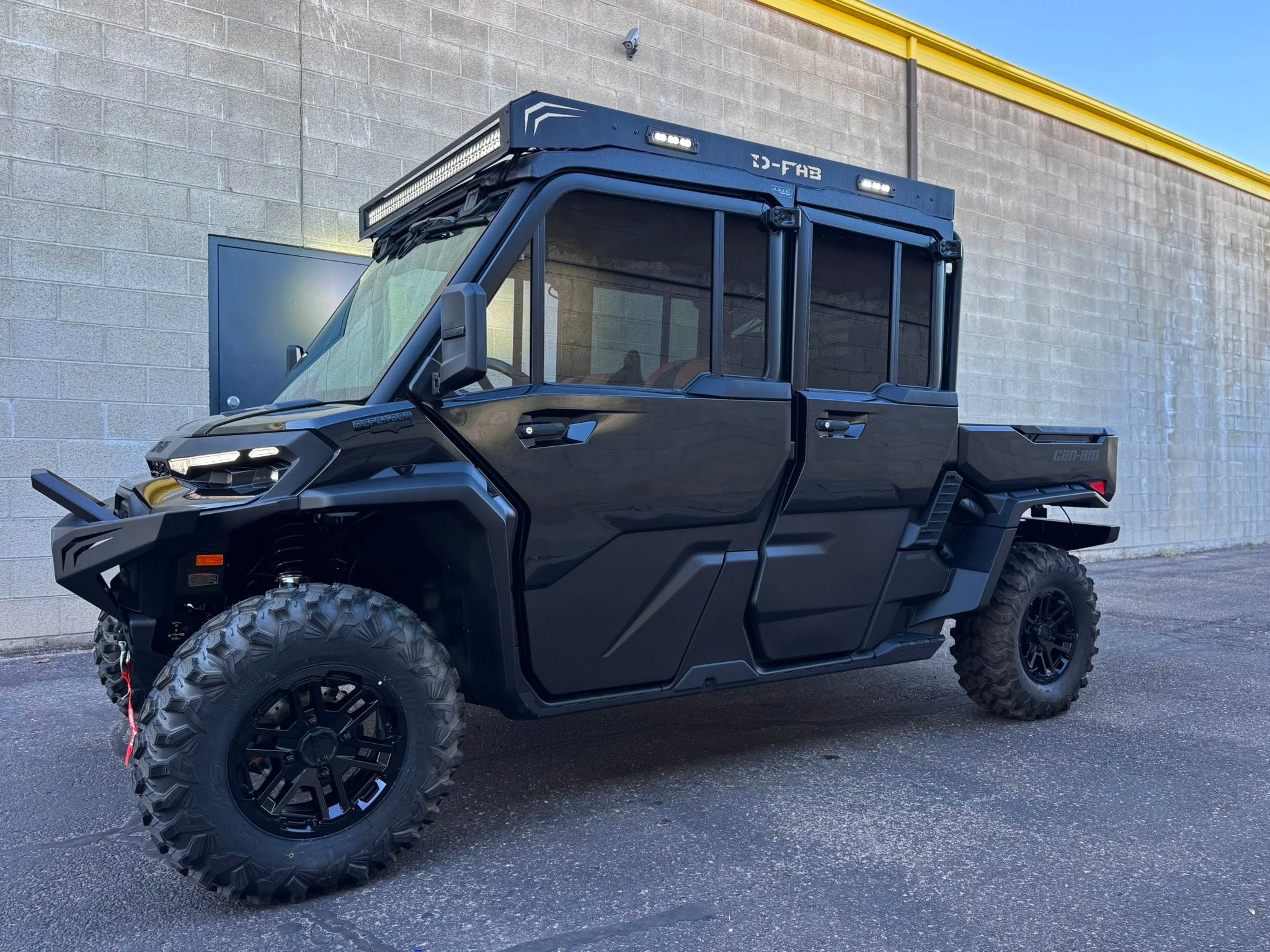 D-FAB Can-Am Defender side profile with custom doors and roof rack